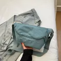 Minimalist Morandi blue nylon crossbody bag with wide strap and zip closure - Haze Blue