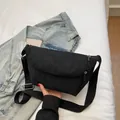 Minimalist black nylon crescent crossbody bag with adjustable strap and double zipper - Black
