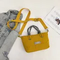 Chic yellow crossbody bag with braided rope handle and adjustable fabric strap - Yellow