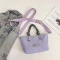 Light purple casual tote bag with woven handles and adjustable wide strap - Purple