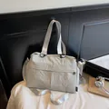 Detail of grey nylon tote bag with white logo embroidery and large storage capacity - Lime White