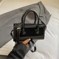 Chic black patchwork rectangular handbag with silver hardware and adjustable strap - Black