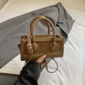 Fashionable caramel brown square handbag with mixed leather textures and dual handles - Brown