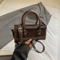 Coffee brown PU leather square handbag with stylish matte splicing and shoulder strap - Brown