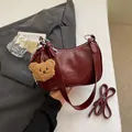 Vintage burgundy leather underarm bag with plush bear charm and silk scarf detail - Style With Plush Bear Pendant / Burgundy