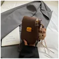 Retro dark brown leather crossbody phone bag with gold clasp and plush dog charm - Coffee With Pendant