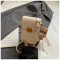 Chic beige vertical crossbody phone bag with gold clasp and brown teddy bear charm - Cream White with Pendant