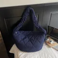 Deep blue heart-quilted crossbody crescent bag with adjustable padded shoulder strap - Dark Blue