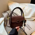 Brown suede crossbody bag with vintage wooden beads and smooth leather trim finish - Brown