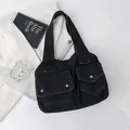 Black denim tote bag with dual front flap pockets and silver metal buttons in casual style - Blue