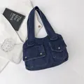 Dark blue denim tote bag with dual front flap pockets and metallic snap buttons - Navy Blue