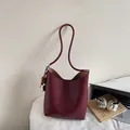 Retro deep wine red leather bucket bag with wooden bead charm and long shoulder strap - With Pendant / Burgundy