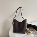 Dark brown vintage oil wax leather bucket bag with ethnic beaded charm and silver hardware - With Pendant / Coffee