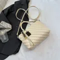 Cream pleated woven handbag with chocolate charm and adjustable crossbody strap - White