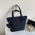 Large black nylon tote bag with matching round zipper pouch and JUMAITU logo label - Black