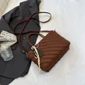 Brown woven PU leather handbag with shoulder strap and chocolate pendant charm - Brown