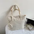 Off-white canvas tote bag with round coin purse and exterior pocket for daily use - Off White