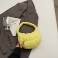 Bright yellow quilted puffer shoulder bag with a stylish crescent design and soft texture - Yellow