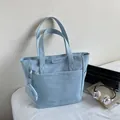 Light blue minimalist canvas tote bag with matching round coin purse accessory - Blue