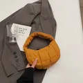 Quilted puffer handbag in bright ginger yellow with puffy shoulder strap and soft texture - Brown