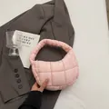 Chic pink quilted nylon shoulder bag with a puffy texture on a dark grey background - Light Pink
