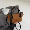 Vintage brown quilted suede bucket bag with black leather handles and gold metal logo - Brown