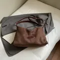 Minimalist dark brown suede tote bag with adjustable strap and vintage leather logo - Brown