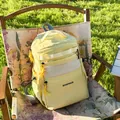 Sac à dos en nylon jaune vif avec poches en filet blanc et tirettes nouées - Jaune