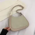 Detail view of contrast color Hobo bag with adjustable strap and Fashion & Bag logo - Off White