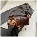 Retro brown oil wax cylinder bag with wide handle and leopard heart charm - With Pendant / Coffee PU