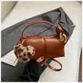 Brown barrel crossbody bag with leopard heart charm and wide shoulder strap - With Pendant / Brown PU Leather