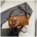Retro brown suede pillow bag with wide leather strap and leopard heart charm detail - With Pendant / Suede Brown