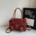 Retro burgundy patent leather Boston bag with bow details and brown top handles - Burgundy