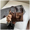 Retro leopard print suede shoulder bag with brown leather strap and plush bear charm - Brown Leopard With Pendant