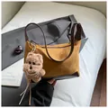 Retro faux suede leopard brown underarm bag with cute plush puppy charm and pearl detail - Brown with Pendant