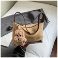 Retro suede hobo bag in brown with adjustable leather strap and plush puppy charm - Khaki With Pendant