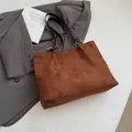 Brown hollow-out suede tote bag with laser-cut floral patterns and black leather straps - No Pendant / Brown