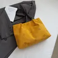 Bright yellow laser-cut suede tote bag with minimalist floral patterns and black straps - No Pendant / Yellow