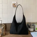 Minimalist black matte suede tote bag with wide shoulder strap for daily commuting - Black