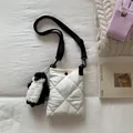 Detail of white quilted bucket bag with adjustable strap and cute penguin plush charm - White With Pendant