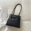 Chic black grained leather tote bag with elegant beaded accents and top handle design - Black