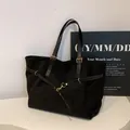 Retro black large capacity tote bag with matte texture and gold hardware details - Black