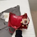 Glossy red minimalist leather tote bag with cute plush bear charm and adjustable strap - With Pendant / Red