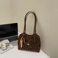 Retro leopard print handbag with leather bow detail and decorative wood bead tassel - Leopard Brown With Charm