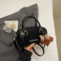 Black bowling bag in matte leather with M'DoLuN embroidery and a plush bear charm - With Pendant / Black