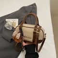 Beige and brown suede bowling bag with teddy bear charm and adjustable shoulder strap - With Pendant / Off White