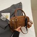 Brown suede bowling bag with leather handles and a cute plush bear charm decoration - With Pendant / Brown