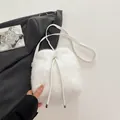 Chic white faux fur bucket bag with drawstring closure and chain strap for women - White