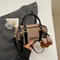 Brown suede bowling bag with black leather straps and a cute plush puppy pendant - With Pendant / Light Khaki