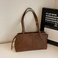 Dark brown faux leather tote bag with vertical stitching and adjustable slim shoulder straps - Brown